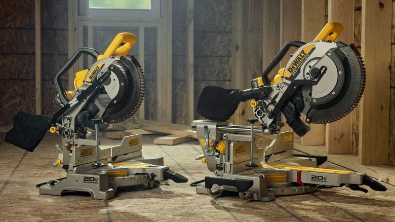 Two DeWalt miter saws on construction site