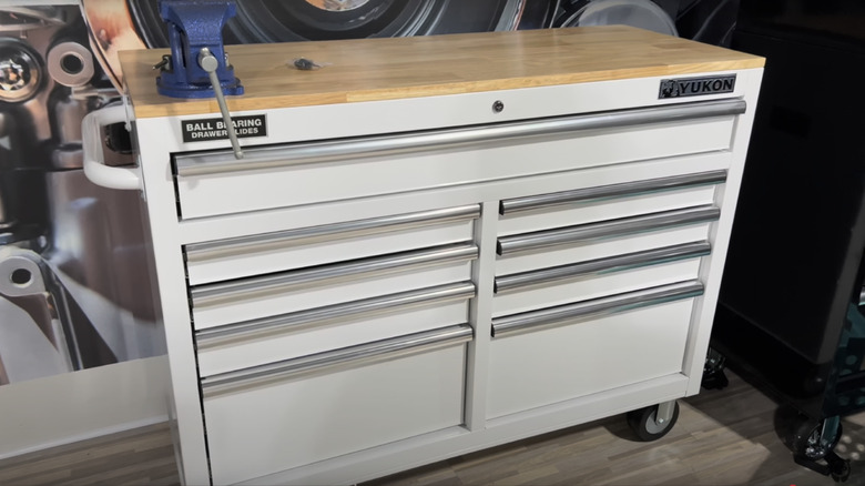 A white Yukon toolbox with a wooden top